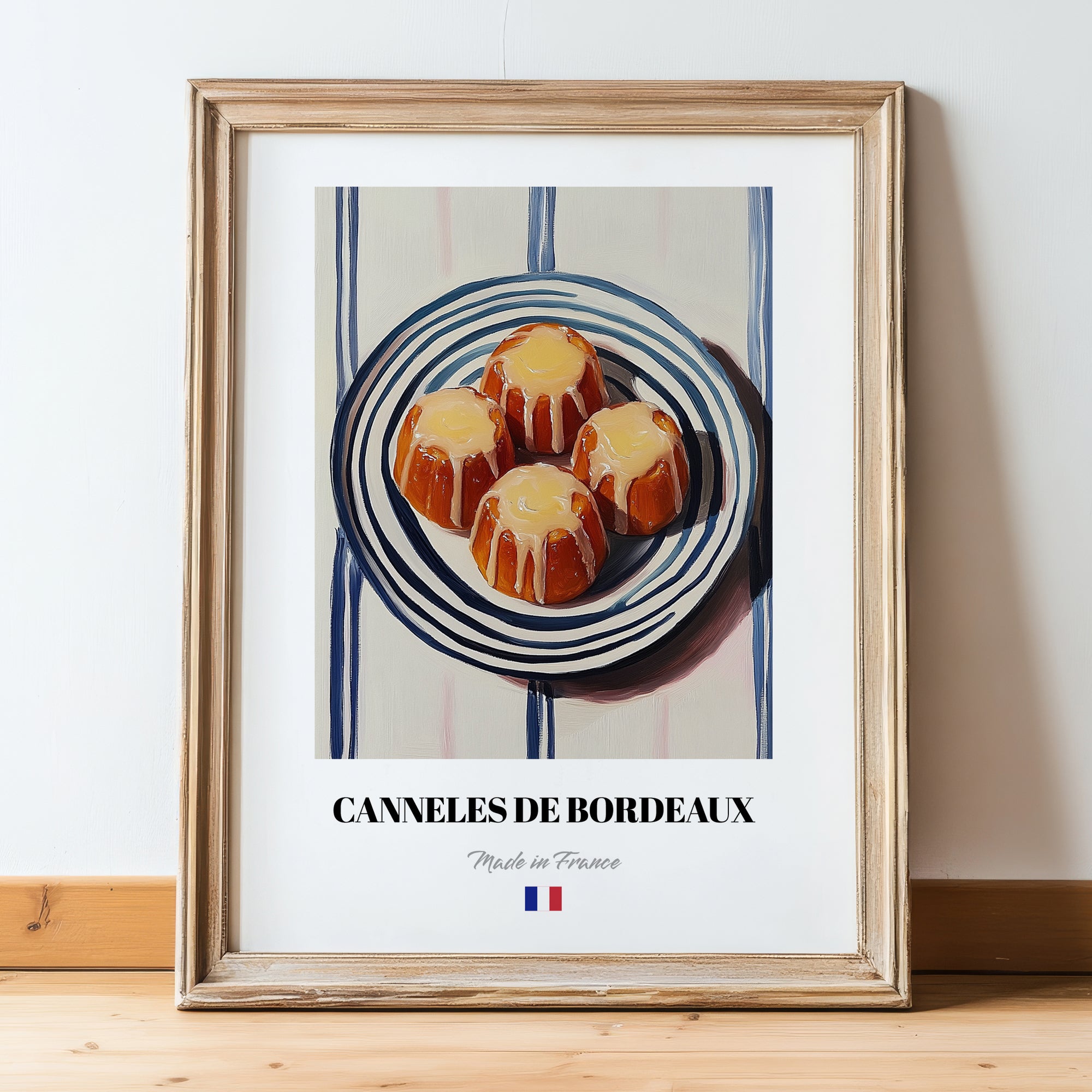 Canelés de Bordeaux – on Striped Tablecloth, French French Pastry Still Life, in wooden frame leaning on the floor
