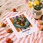 Kleftiko – on Striped Tablecloth, Greek Food Illustration, unframed on coastal sand