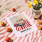 Borovička – on Striped Tablecloth, Slovak Beverage Poster, unframed on coastal sand
