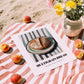 Multigrain Bread – on Striped Tablecloth, American Food Poster, unframed on coastal sand