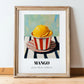 Mango – on Striped Tablecloth, Gelato Wall Poster, in wooden frame leaning on the floor