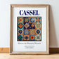 Cassel, France – World Heritage Travel Poster, in wooden frame leaning on the floor